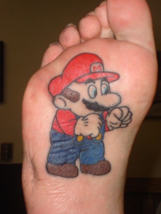  tattoo-style, on the bottom of their feet, one gaming icon per foot.