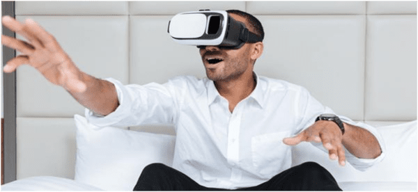 Man in a white shirt with virtual reality headset on